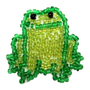 May include: A green beaded frog with black eyes. The frog is made of small green and light green beads.