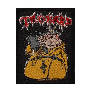 May include: A black and white embroidered patch with the band name "TANKARD" in red and white lettering. The patch features a cartoon monk wearing a yellow robe and a halo, holding a large beer stein.
