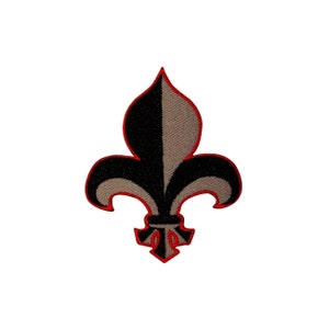 May include: A black and gray embroidered fleur-de-lis patch with a red outline.