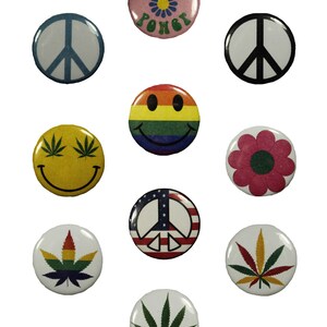May include: Nine round buttons with various designs, including a peace sign, a smiley face, a flower, and a marijuana leaf. The buttons are all different colors and have a white background.