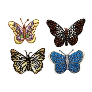 May include: Four embroidered iron-on patches featuring different butterfly designs. The butterflies are in shades of brown, yellow, blue, and purple.