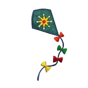 May include: A blue kite with a yellow sun design and a tail of red, green, and yellow bows.