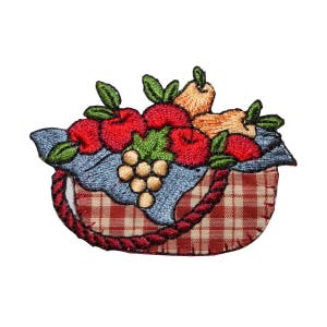 May include: Embroidered patch of a red and white checkered basket filled with red apples, pears, and grapes. The basket is surrounded by green leaves.