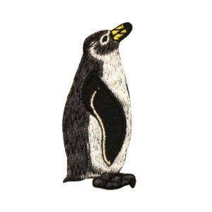 May include: A black and white embroidered penguin patch with a yellow beak. The penguin is standing upright with its wings tucked in.