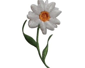 May include: White daisy flower with a yellow center and green stem and leaves. The flower is embroidered and has a fuzzy texture.