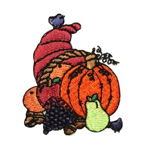 May include: An embroidered patch featuring a cornucopia overflowing with autumn harvest items, including a pumpkin, pear, grapes, and an orange. The cornucopia is decorated with a brown rope and a small blue bird.