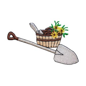 May include: An embroidered patch of a shovel with a brown wooden bucket filled with dirt and yellow flowers on top. The shovel is silver and the bucket is brown with a white rim.