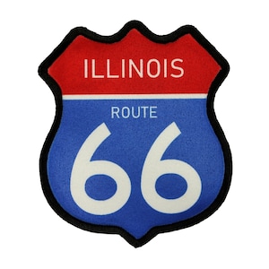 May include: A blue and red highway sign with a white border and the text "Illinois Route 66" in white.