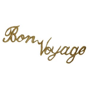 May include: Gold glitter lettering spelling out "Bon Voyage" on a white background.