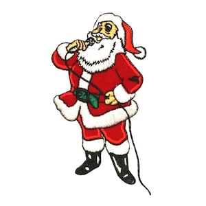 May include: An embroidered iron-on patch of Santa Claus singing into a microphone. He is wearing a red suit with white trim, a white beard, and a red hat.