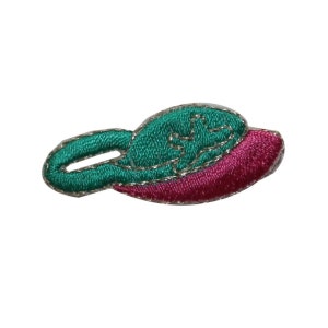 May include: An embroidered patch shaped like a boat, with green and pink fabric and a silver outline.