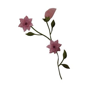 May include: Pink embroidered flower applique with green stems and leaves. The flowers have five petals each.