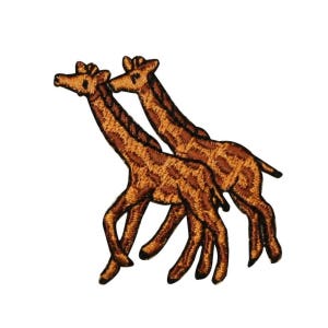 May include: Two brown and tan embroidered giraffe patches, one behind the other, with their necks bent towards each other.