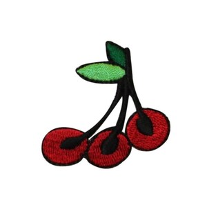 May include: Three red cherries with green leaves and black stems. The cherries are embroidered on a white background.