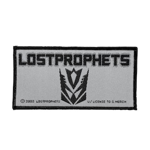 May include: A gray and black embroidered patch with the text "LOSTPROPHETS" and a stylized logo. The text "© 2002 LOSTPROPHETS U/LICENSE TO G. MERCH" is also included.
