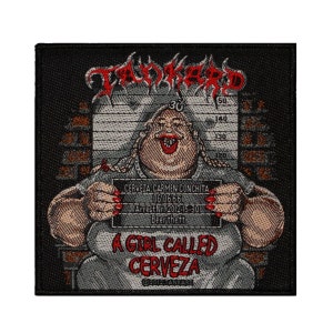 May include: A black and white embroidered patch with a cartoon image of a woman holding a mugshot. The mugshot reads "CERVEZA CARMEN CONCHITA 06.06.66 Arrest Nr. 2012-15-30 Beer theft". The text "A GIRL CALLED CERVEZA" is below the mugshot. The text "TANKARD" is at the top of the patch.