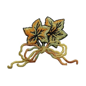 Può includere: Toppa ricamata con due foglie gialle e verdi con steli marroni e un tralcio marrone, giallo e arancione.