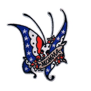 May include: An embroidered patch featuring a butterfly with red, white, and blue wings. The butterfly is holding a banner that reads "Momma".