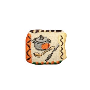 May include: Embroidered iron-on patch with a brown, orange, and white design. The patch features a pot, spoon, and fork.