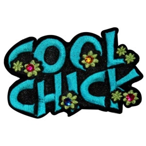 May include: A turquoise blue embroidered patch with the text "COOL CHICK" in a stylized font. The patch is decorated with green and yellow flowers with colorful rhinestones.
