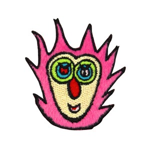 May include: Pink felt patch with an embroidered cartoon face. The face has large green eyes with blue and black pupils, a red nose, and a yellow smile.