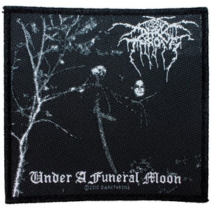 May include: Black and white woven patch with the band name "Darkthrone" and the album title "Under a Funeral Moon".