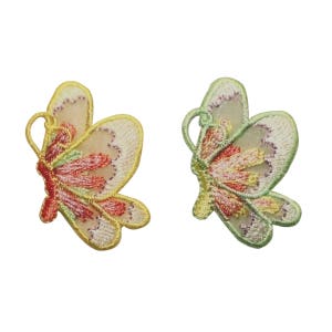 May include: Two embroidered butterfly patches, one in yellow and one in green, with pink and red accents.
