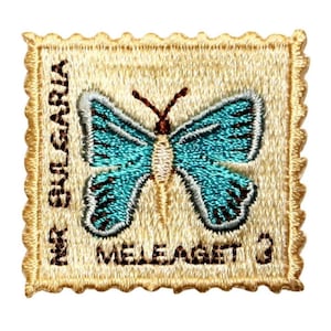May include: A beige embroidered patch with a blue butterfly and the text "The Bulgaria Meleagett"