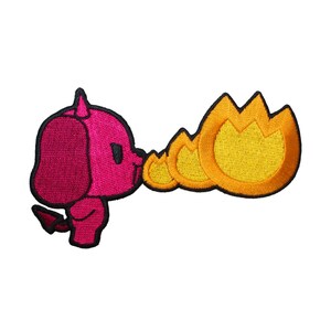 May include: A pink cartoon devil dog with a tail blowing out three yellow flames. The dog has a red nose and black eyes.