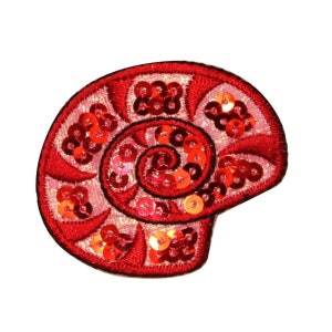 May include: Red embroidered seashell patch with sequins. The seashell is a spiral shape with a pink and red color scheme.