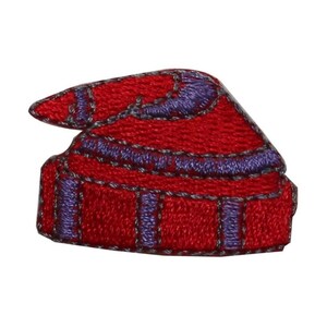 May include: Red and purple embroidered felt stocking cap with a white pom pom on top.