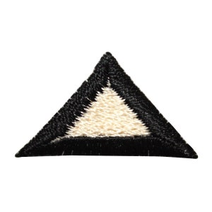 May include: A black triangle patch with a white triangle inside. The patch is made of fabric and has a stitched edge.