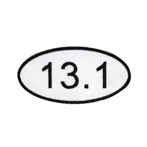 May include: White oval-shaped patch with black embroidered text "13.1".