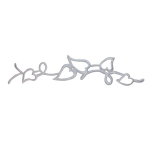 May include: A silver-colored decorative vine with heart-shaped leaves. The vine is a continuous line with no breaks.