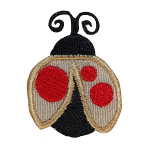 May include: A red and black ladybug with gold trim and white accents. The ladybug has two large red spots and two smaller red spots on its wings.