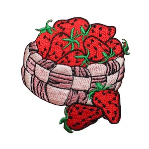May include: Embroidered patch featuring a basket overflowing with ripe red strawberries. The basket is woven with pink and white threads, and the strawberries have green stems. A charming, colorful design.