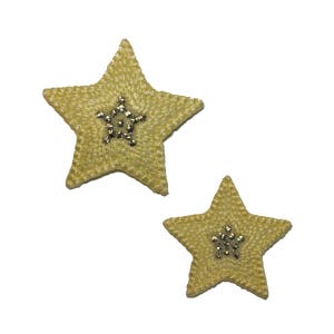 May include: Two yellow fabric star-shaped patches with a silver rhinestone center.
