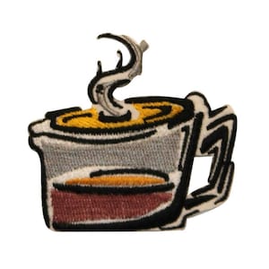 May include: Embroidered patch of a coffee cup with steam rising. The cup has a gray body, a brown base, and a yellow top. The steam is gray and black, and the cup is outlined in black.