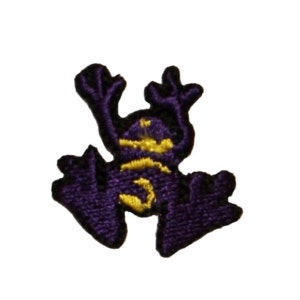 May include: Purple frog applique with yellow details. The frog is in a jumping pose with its legs outstretched.