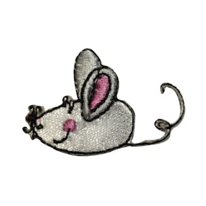 May include: A white embroidered mouse with pink ears and a black nose. The mouse is lying on its side with its tail curled up.