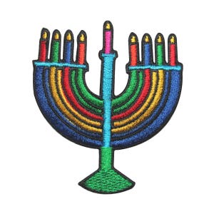 May include: A colorful embroidered patch of a menorah with nine candles, featuring a rainbow design with blue, green, yellow, orange, red, and pink accents.