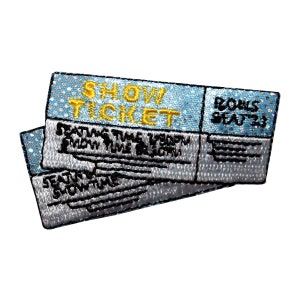 May include: A blue and silver embroidered patch that says "Show Ticket" with the words "Rows Seats" in the top right corner. The patch is designed to look like a ticket stub.