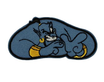 May include: A blue embroidered patch of a genie from Aladdin, with a mischievous expression and a gold band around his waist. The genie is in a sitting position with his arms crossed.