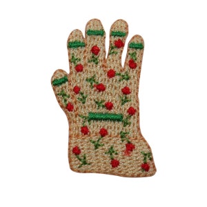 May include: A beige embroidered patch of a hand wearing a gardening glove with red flowers and green leaves.