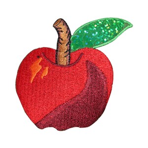 May include: A red embroidered apple with a brown stem and a green sequined leaf.