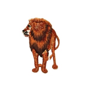 May include: Embroidered iron-on patch of a brown lion standing with its head turned to the side. The lion has a detailed mane and a realistic appearance.