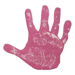 May include: A pink handprint with a textured surface. The handprint is made of fabric and has a white pattern.