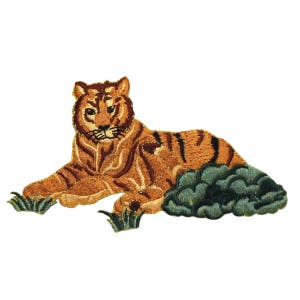 May include: Embroidered iron-on patch featuring a brown and orange tiger lying down in green grass.