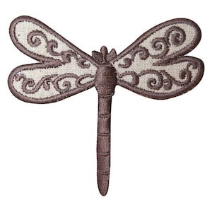 May include: A brown embroidered dragonfly with white fabric wings and intricate floral designs. The dragonfly is a decorative patch or applique.