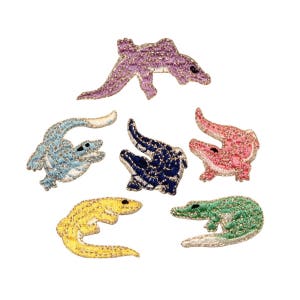 May include: Six embroidered alligator patches in various colors, including pink, blue, green, yellow, and purple. The patches are all about 2 inches long and feature detailed stitching.